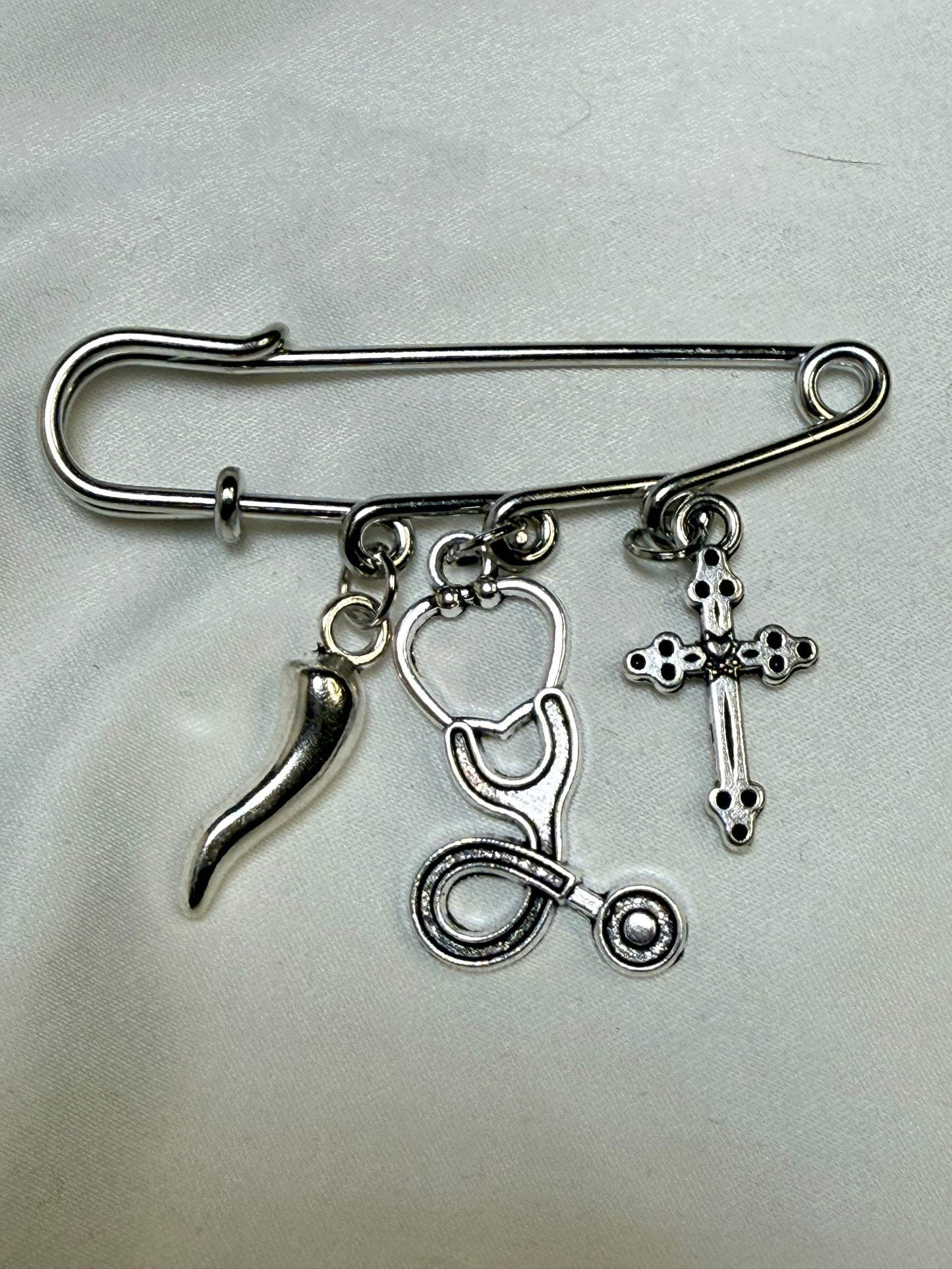 Stethoscope pin with Italian horn on cross