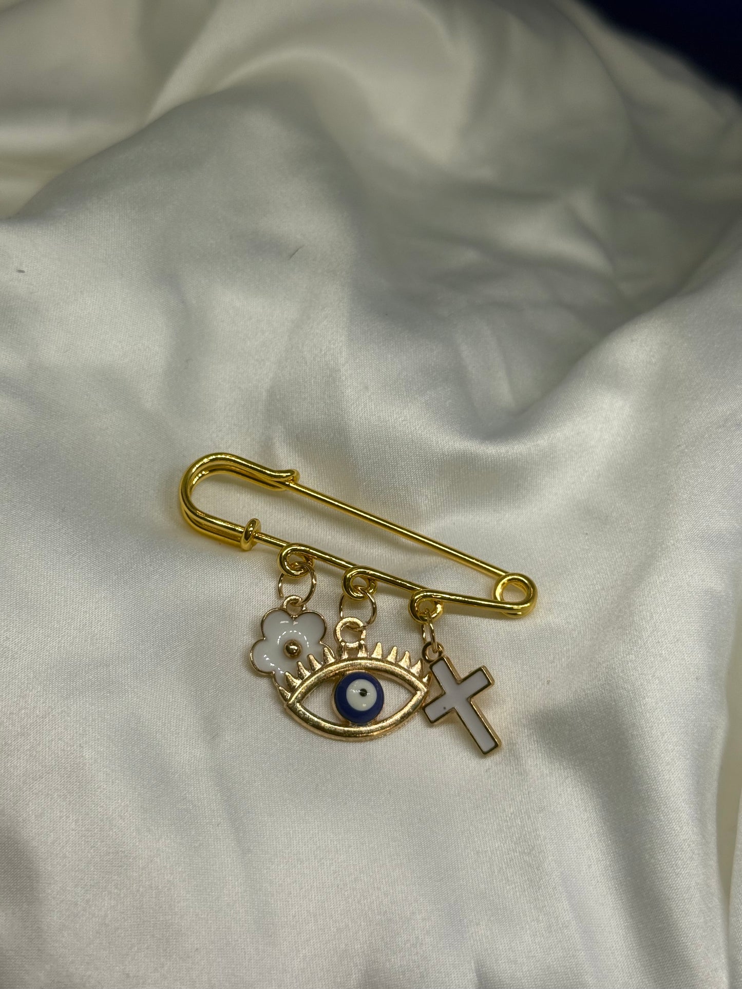 White and gold protection pin