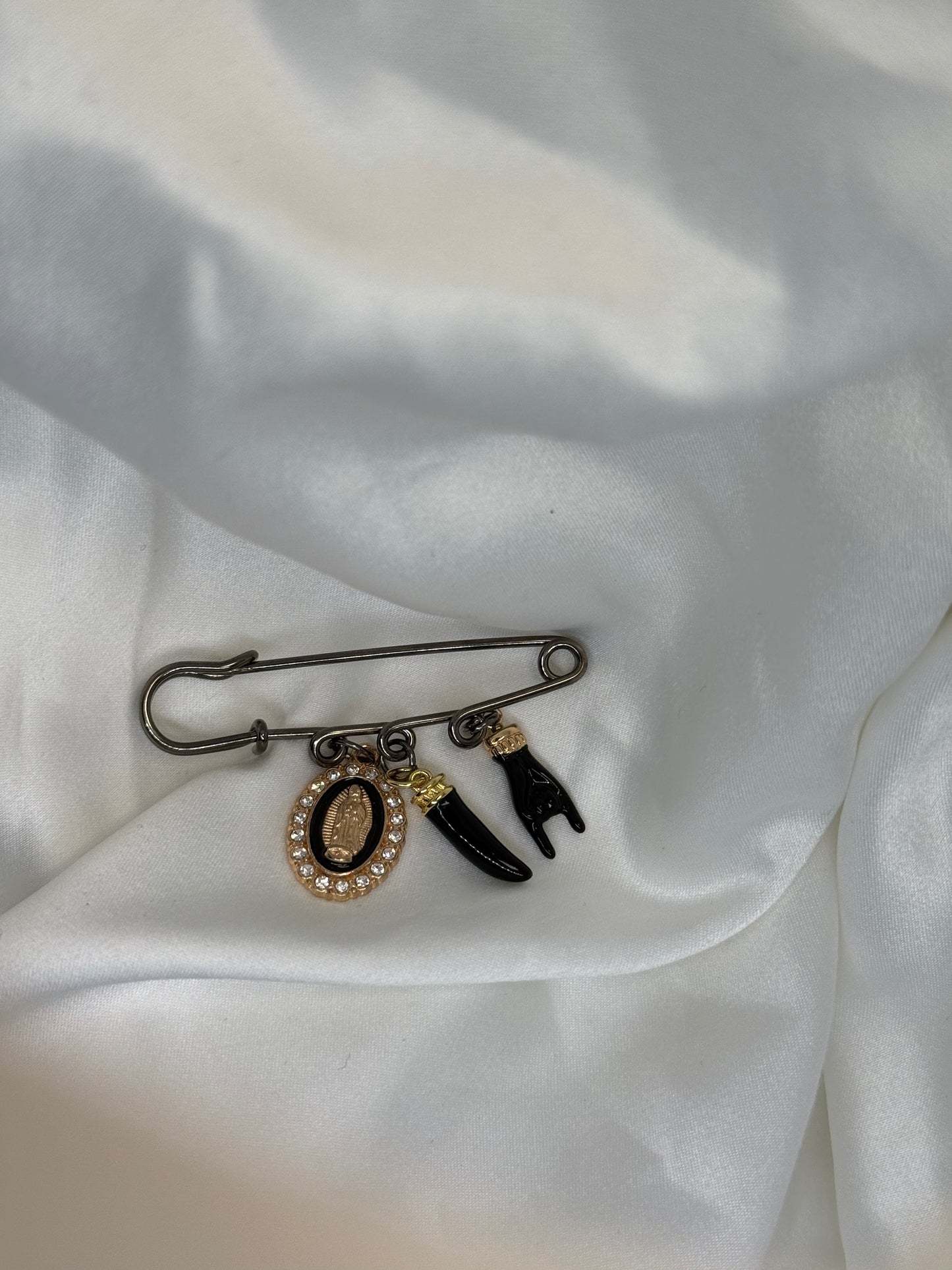 Black and gold pin