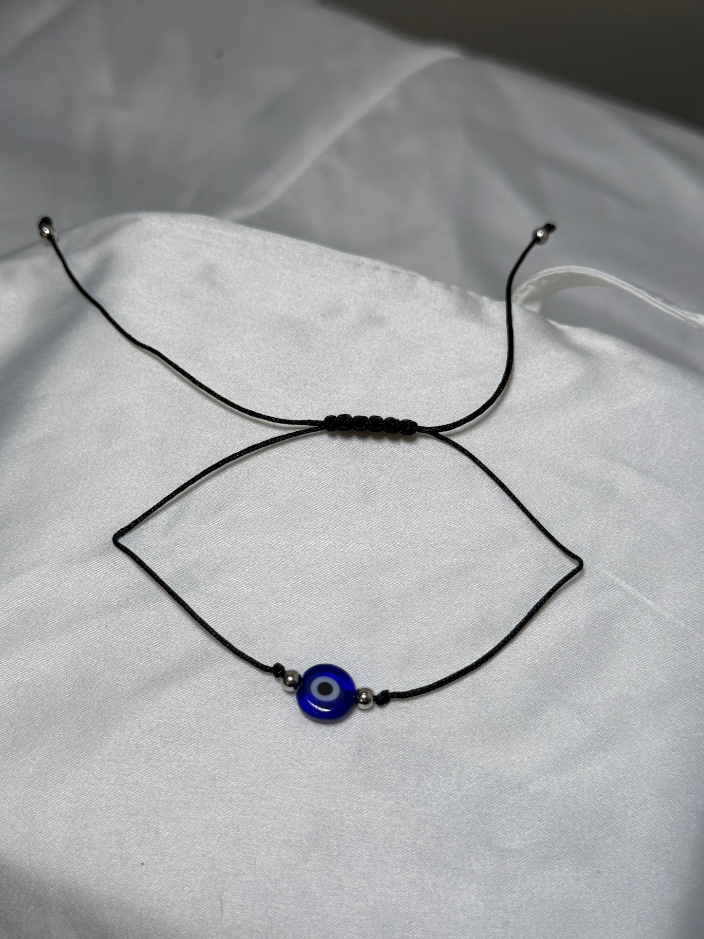 Black string evil eye bracelet