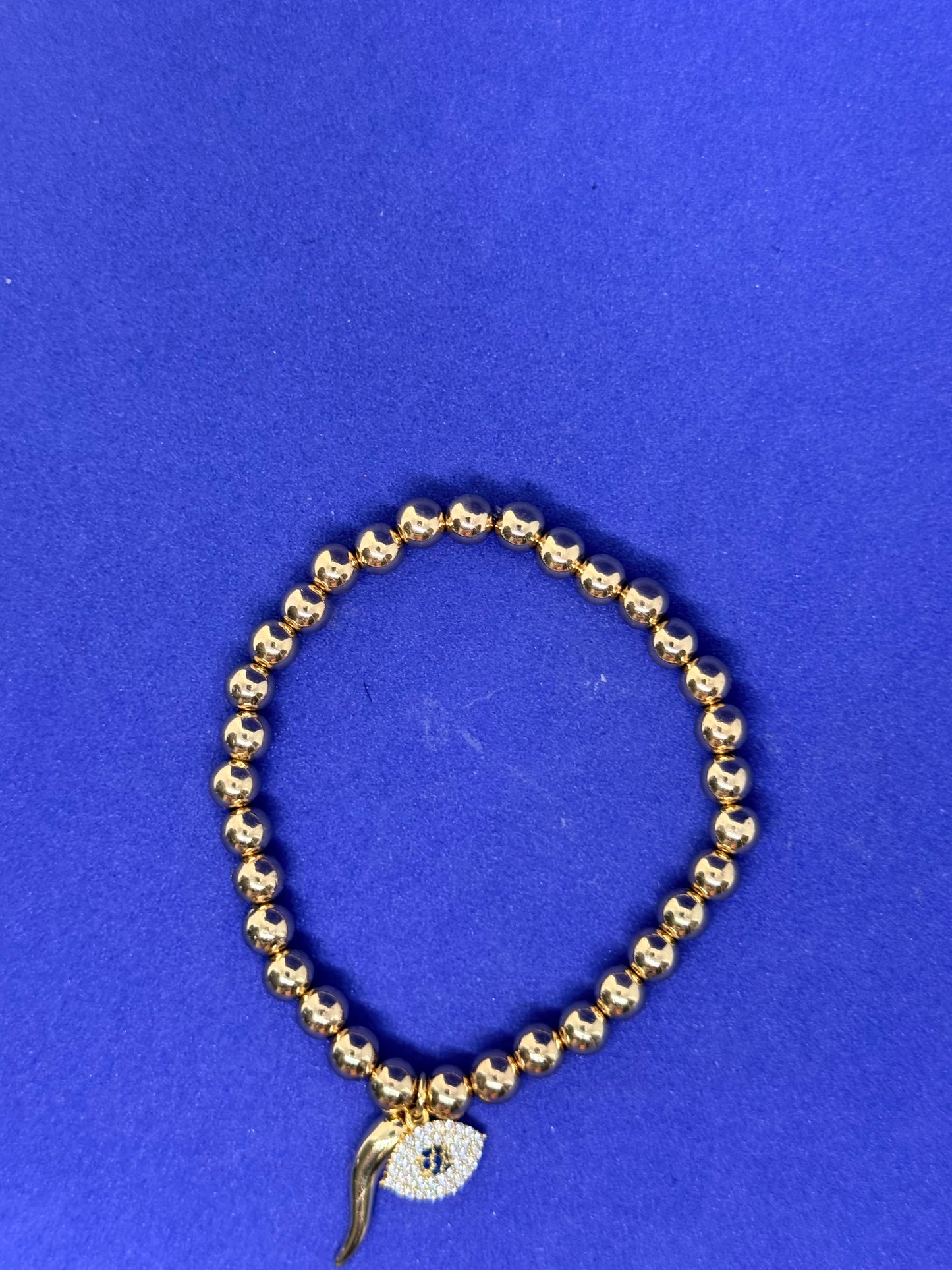 Evil eye and horn bracelet
