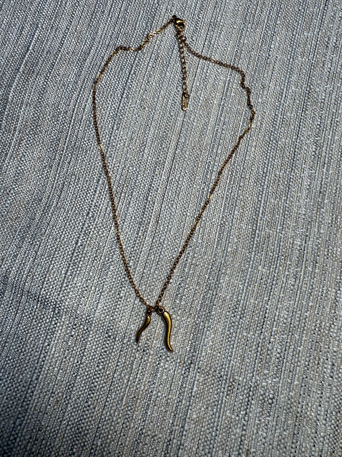 Gold colored double horn chain