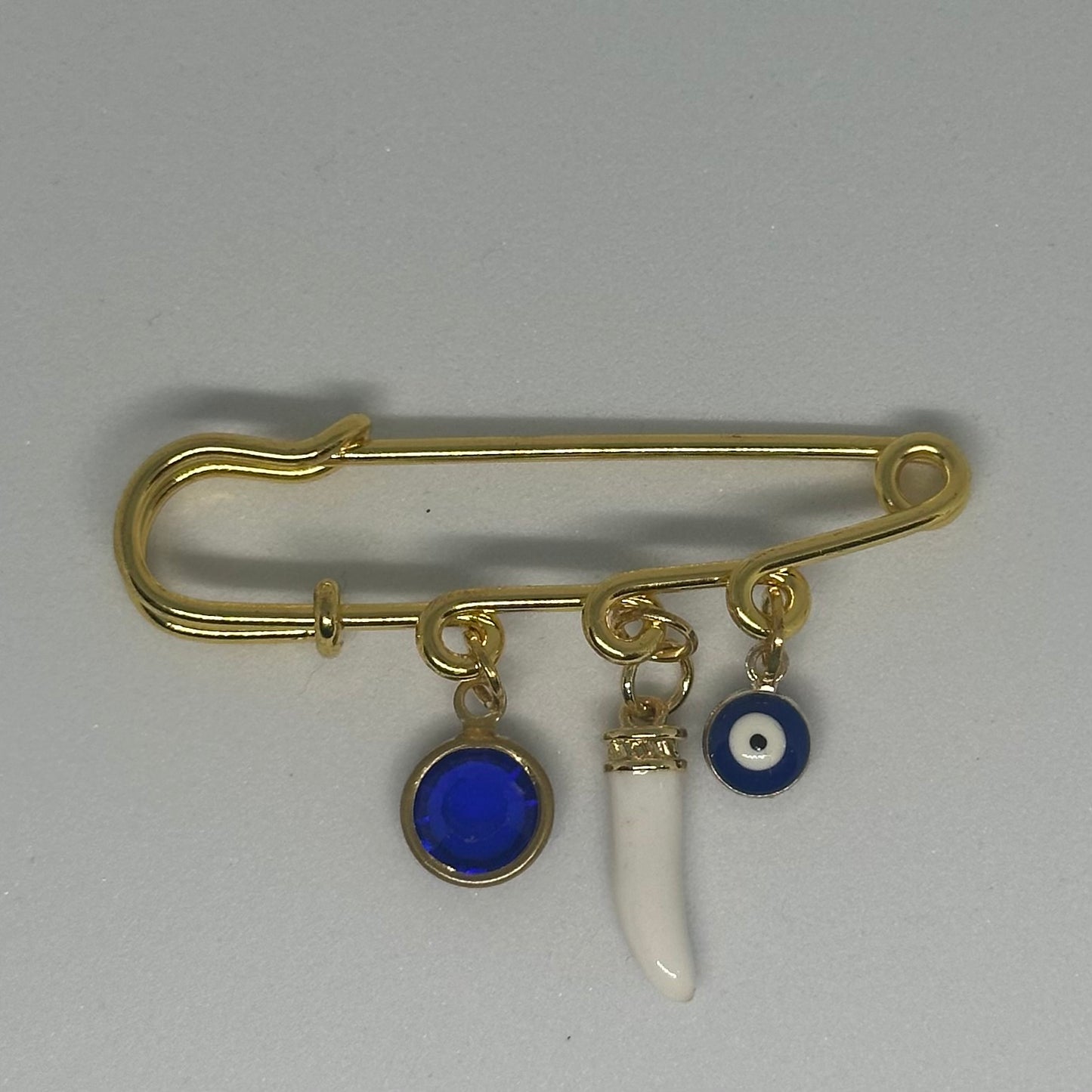 Gold, blue and white protective pin