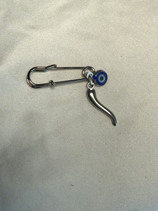 Silver horn eye garment pin