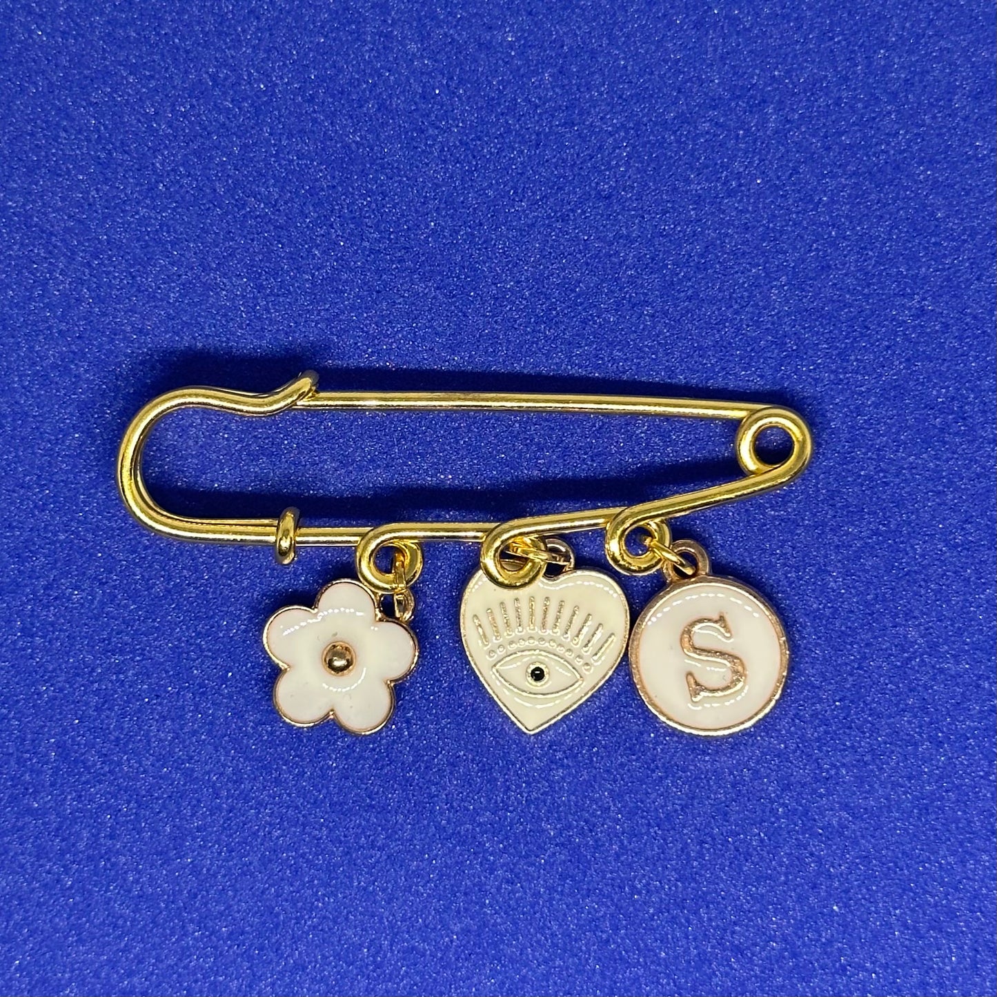 Gold and white pin