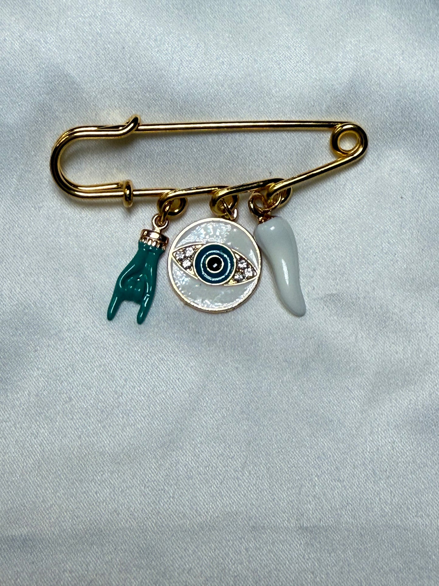 Evil eye with turquoise italian hand and and white horn
