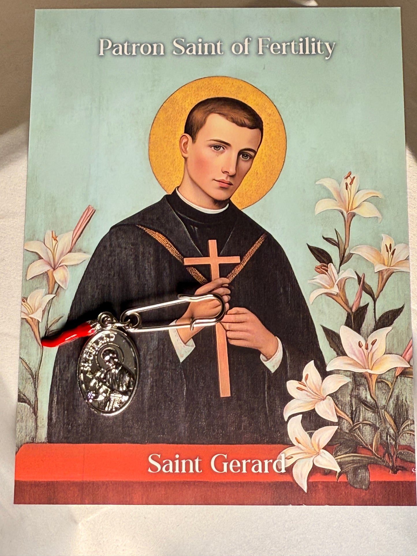 Saint Gerard fertility garment charm with the red horn