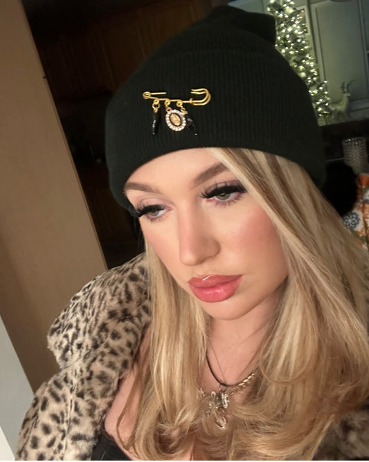 Knit hat with ultimate protection, black pin attached