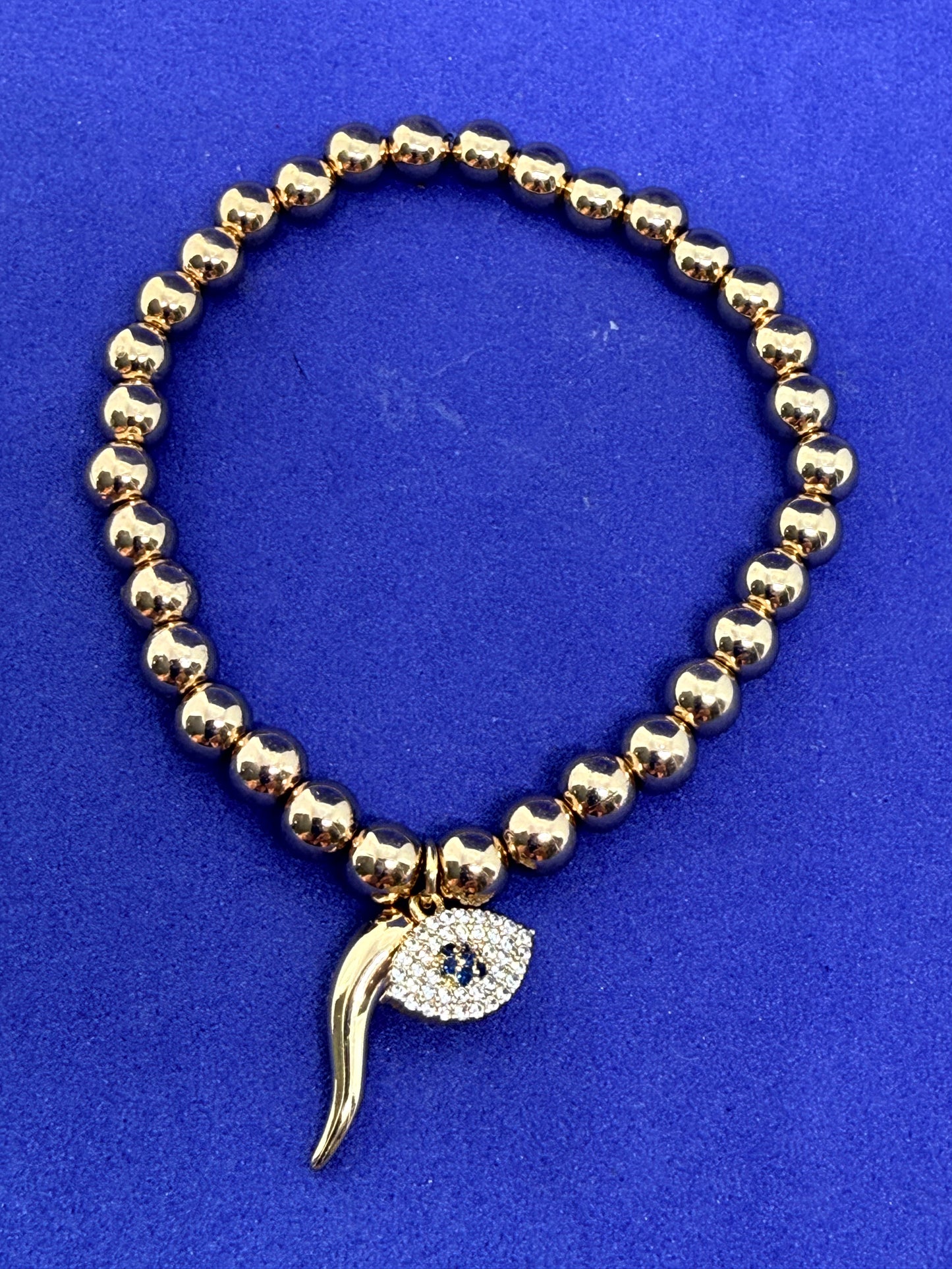 Evil eye and horn bracelet
