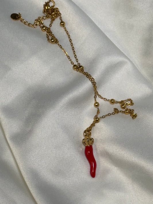Large red horn with crown necklace