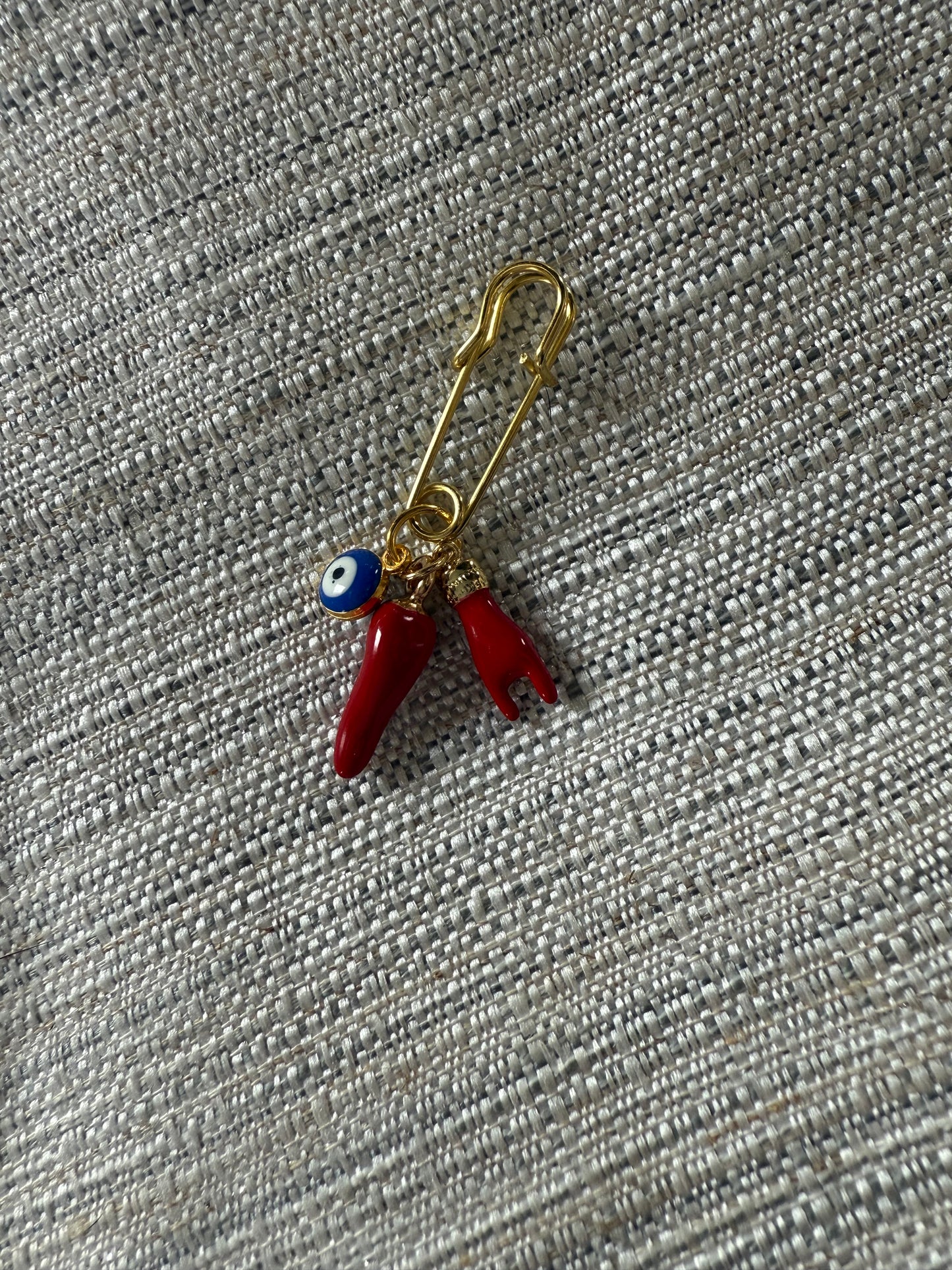 Garment pin with Italian hands, horn and evil eye