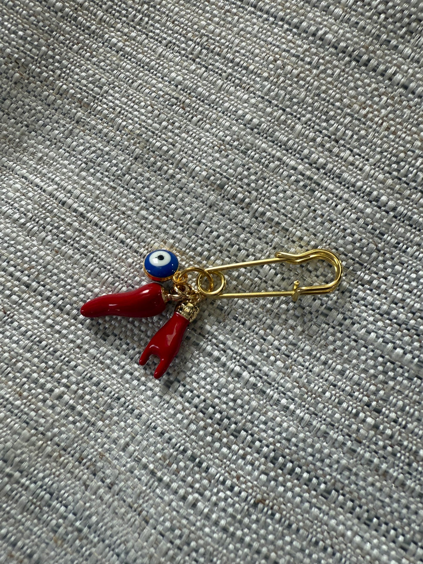Garment pin with Italian hands, horn and evil eye