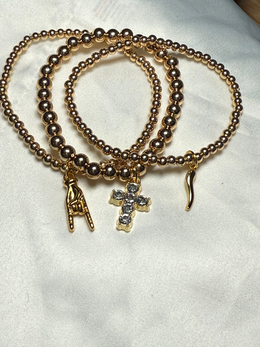 Three bracelet stack with tiny hands, bling cross, and Italian horn